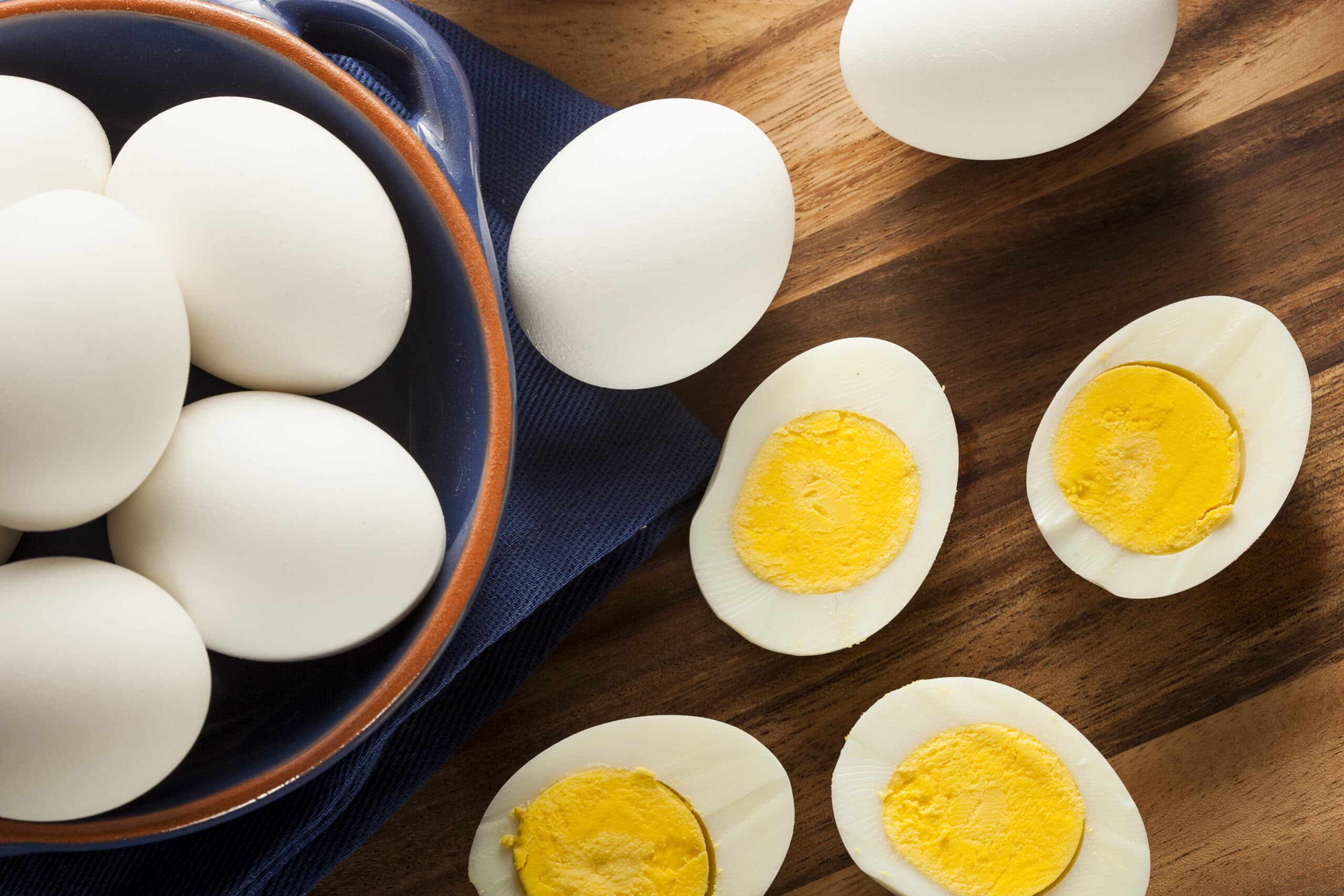 Freshly prepared eggs on a rustic breakfast table